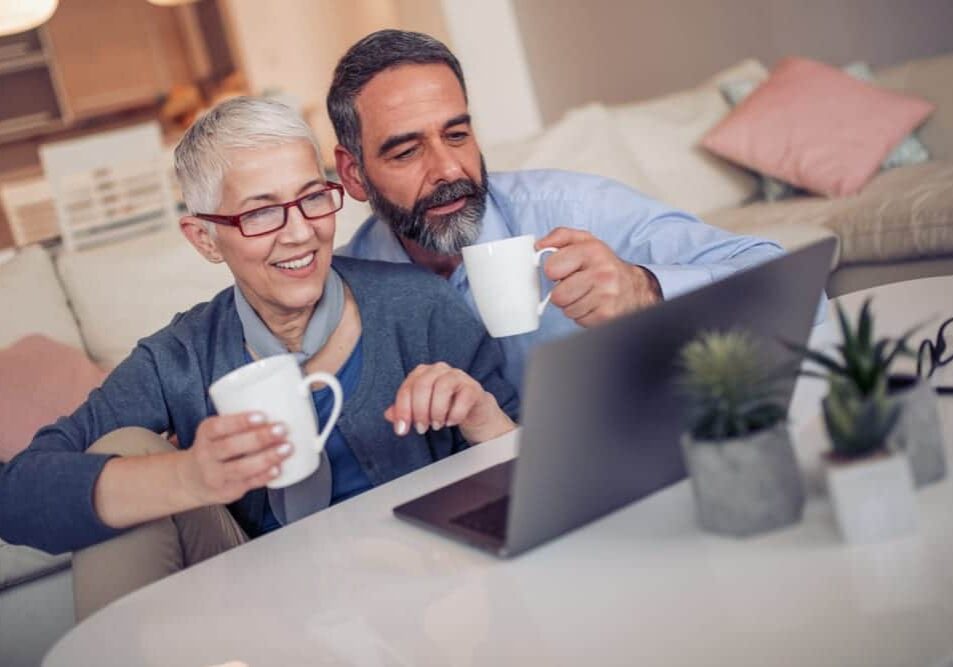 Man and woman reviewing Gary Smith Agency website