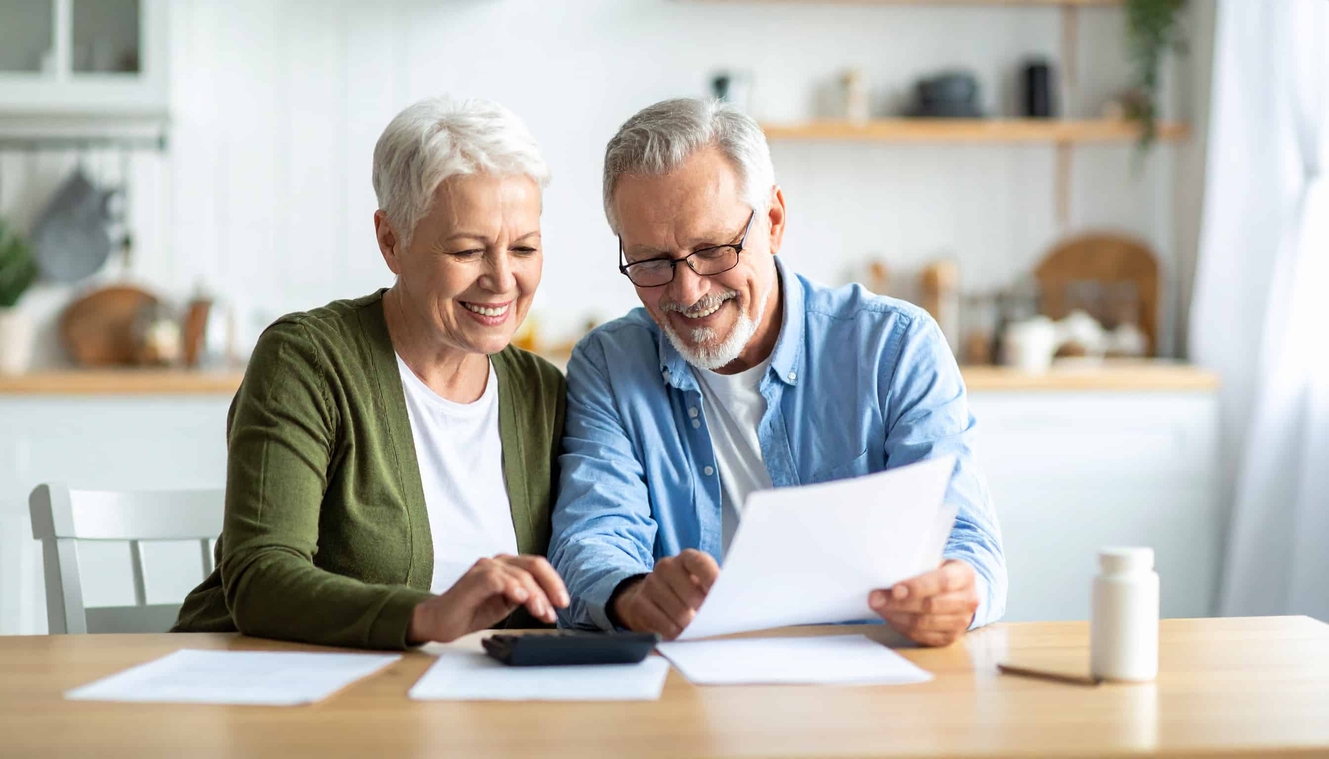 Senior Couple Reviewing Medicare Costs Senior Couple Reviewing Medicare Costs