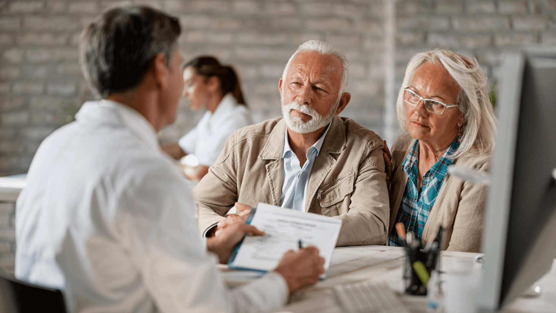 Seniors Discussing Medicare Options Seniors Discussing Medicare Options